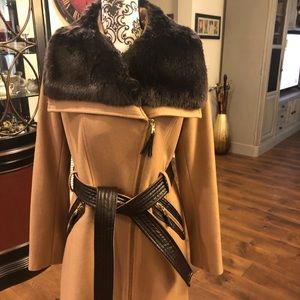3/4 length camel zipper and belted coat with faux fur trim.